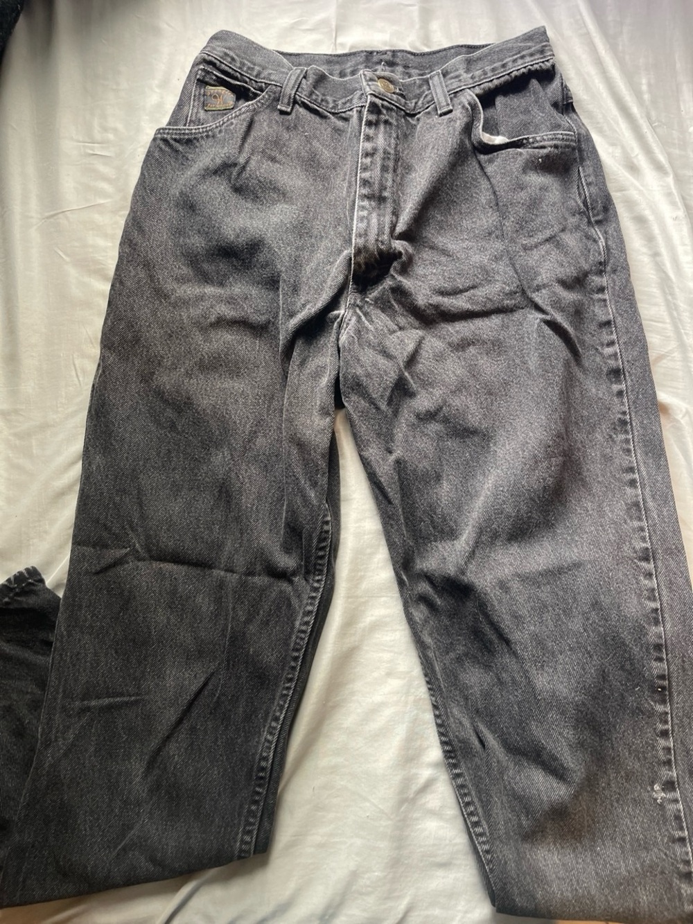 black denim jeans with a relaxed fit Wrangler for women. No tag so I measured